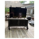 Outdoor television and stand with cover