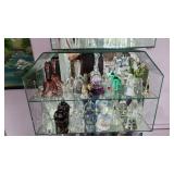 Collection of bells, inside a fabulous glase display case. All for sale.