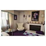 Living room furniture, paintings, and decorations.