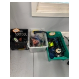 Some saltwater fishing gear including fishing line, some poles, and many ocean lures. 