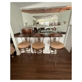 Three tall cushioned barstools