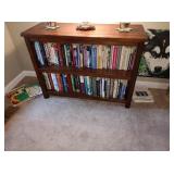 TV Room:  Wood Book Case, Books--Running, Scuba Diving, Hiking, Camping