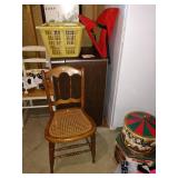 Basement:  Cane Chair, Small Refrigerator, Freezer 