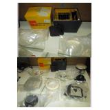 Garage:  Simon Omega Enlarger w/Lens, Aluminium Spacers, Box of Tinted Lens, 2 Half-Moon Thick glass