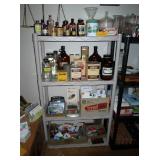 Pharmacy medicine bottles (top 2 shelves)  Cards--Paper pads--Office stuff (bottom 2 shelves)