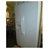 Roper White side by side refrigerator/freezer with water and ice in door