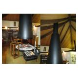 Large fire pit in the middle of the living room Note: the beams that are used for the ceiling