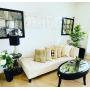 Chaise, coffee table, art, plants