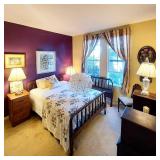 Antique beds, lamps and photographs from 1800s