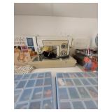 Sewing machine, sewing books, sewing basket with threads,semi-precious beads / gems, and instruments