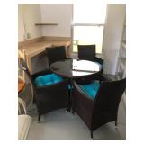 Vinyl Wicker Dinette w/ 36" diameter black glass top and 4 chairs - $345