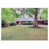 3 Bedroom Brick Tudor Style Ranch on almost an acre with Atrium and All Season Room