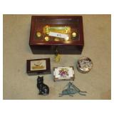 4 MUSIC BOXES ONE MISSING A POWER PLUG TWO CAST IRON DECORATIVE ITEMS AUTHENTICITY UNKNOWN