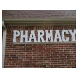 METAL PHARMACY SIGN 95 X 21 MUST BRING TOOLS AND LADDER TO REMOVE