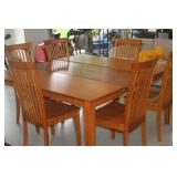 NICE MAPLE TABLE WITH SELF STORING LEAF AND 6 CHAIRS