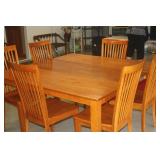 NICE MAPLE TABLE WITH SELF STORING LEAF AND 6 CHAIRS