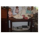 DOLLS ON VINTAGE LIBRARY TABLE