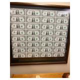 Uncut sheet (32) 1981 one dollar bills framed