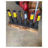 Firework mortar tubes mounted on a wooden base