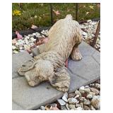 Concrete garden statue of a dog