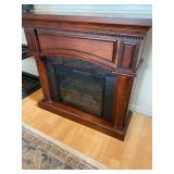 Electric Fireplace - Heater with a wooden Mantel
