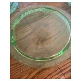 an Anchor Hocking green uranium (vaseline) depression glass cake plate in the Cameo pattern. 