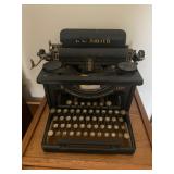  an L.C. Smith & Corona desktop typewriter. the design, with round glass keys and black enamel finis