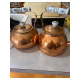  vintage copper tea kettles with blue and white ceramic handles. 