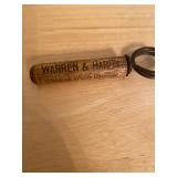 vintage wood-handled pocket corkscrew with advertising for "Warren & Hardy Whiskies Wines Brandies" 