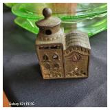 an antique cast iron still bank, commonly known as a "Domed Mosque" or "3-Story Mosque" bank.  It wa