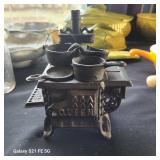  an Old Mountain cast iron miniature "Queen" box stove set, which is a replica of traditional stoves