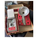 a vintage Anscoflex II camera with its accompanying flash attachment, both housed in their original 