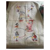 a vintage, handmade Disney character nursery rhyme cross-stitch baby quilt. It features embroidered