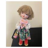 vintage handmade Polish folk art doll.  She is holding a heart that says "Z Miłości" in Polish. 