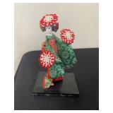 a vintage Japanese geisha or maiko doll, often associated with the traditional "Seven Hat Dance" 