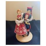 a set of handmade Polish folk art dolls, likely representing the traditional regional costumes of Kr