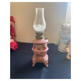 a vintage ceramic pot belly stove oil lamp, typically made in Japan in the 1970s. 