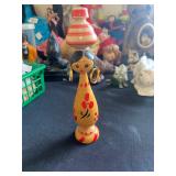 a vintage Egyptian folk art wooden spindle peg doll. 