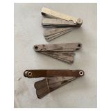  feeler gauge, a tool used to measure small gaps or clearances. 