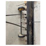 an Agri-Fab tow-behind lawn dethatcher. These dethatchers are designed to remove layers of thatch an