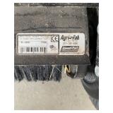 an Agri-Fab tow-behind lawn sweeper. 