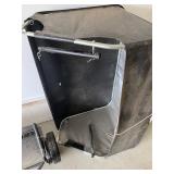 an Agri-Fab tow-behind lawn sweeper. 