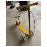 a vintage yellow Honda Kick 