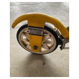 a vintage yellow Honda Kick 