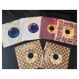 vintage 7-inch vinyl records, primarily 45 rpm singles