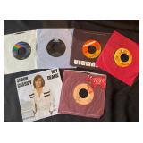 vintage 7-inch vinyl records, primarily 45 rpm singles