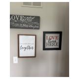 three wall signs focusing on themes of love and togetherness, including a passage from 1 Corinthians