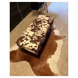 Storage Ottoman Bench featuring a brown and white cow print upholstery