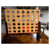 four-in-a-row board game made of finished wood designed for oversized play.