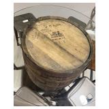 Rustic whiskey barrel bistro table topped with a circular glass surface